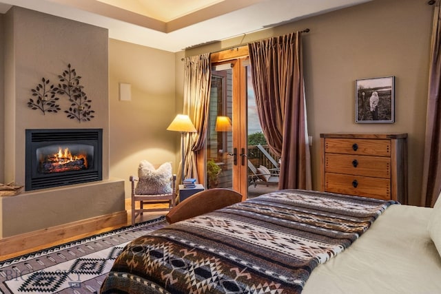 bedroom featuring hardwood / wood-style floors and access to exterior