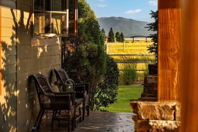 view of patio / terrace with a mountain view