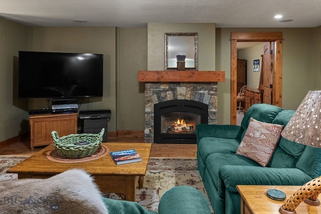 living room with a stone fireplace