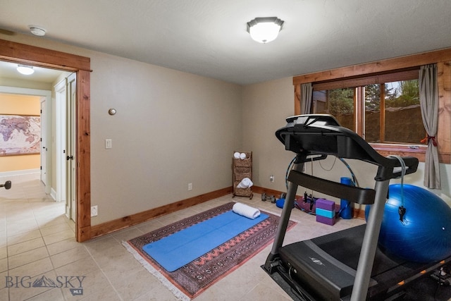 workout area with light tile patterned floors