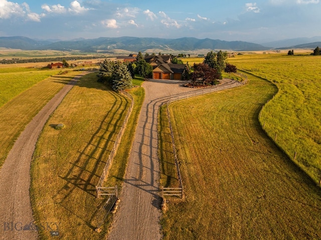 birds eye view of property with a mountain view and a rural view