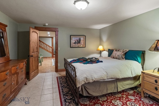 bedroom featuring light tile patterned floors