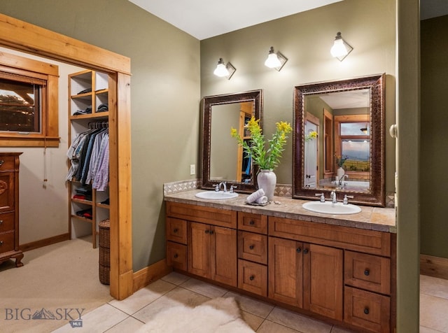 bathroom with tile patterned floors and vanity