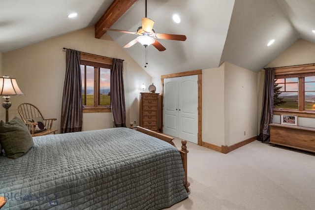 bedroom featuring lofted ceiling with beams, ceiling fan, light colored carpet, and a closet