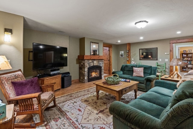 living room with light hardwood / wood-style floors and a fireplace