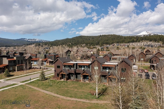 exterior space featuring a yard and a mountain view