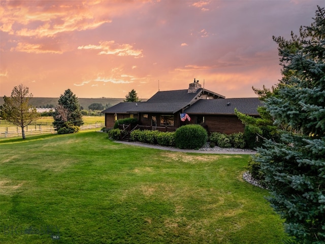 view of yard at dusk