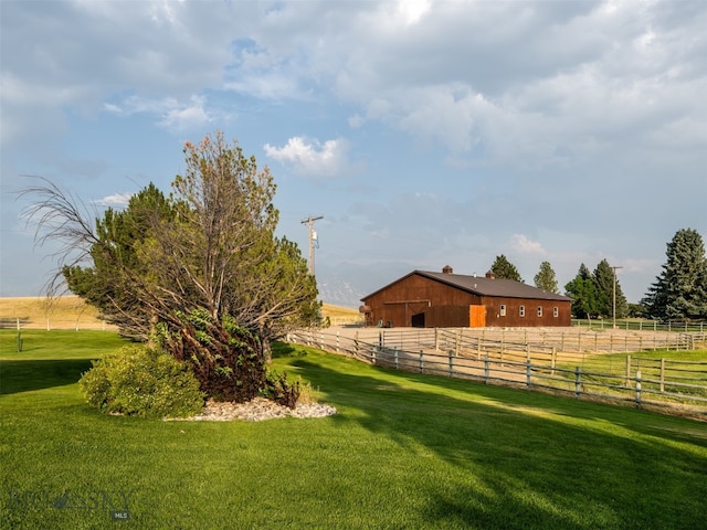 view of yard with a rural view