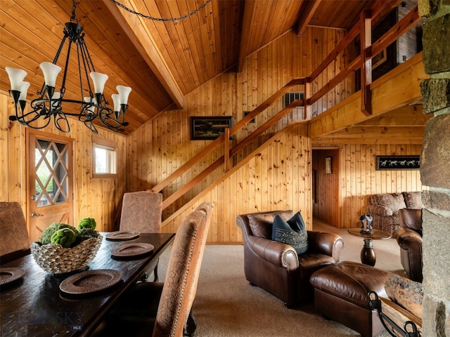 dining area featuring vaulted ceiling with beams, wood ceiling, a chandelier, carpet flooring, and wood walls