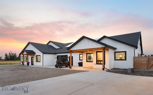 modern farmhouse featuring a garage