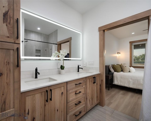 bathroom featuring vanity, hardwood / wood-style flooring, and a shower with shower curtain