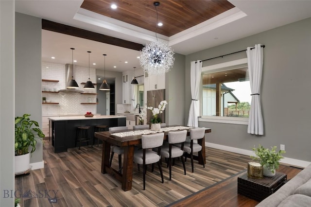 dining room with dark hardwood / wood-style floors, wood ceiling, a tray ceiling, and an inviting chandelier