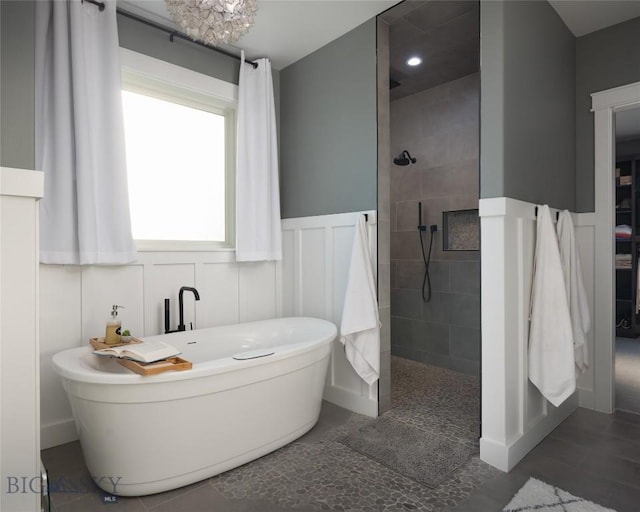 bathroom with separate shower and tub