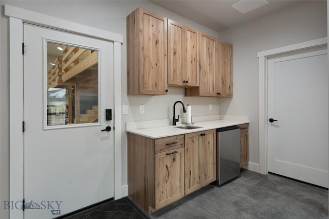 kitchen featuring dishwasher, sink, and light brown cabinetry