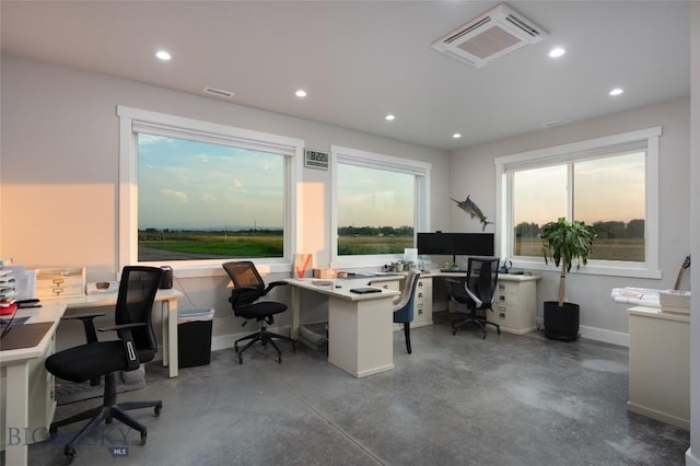 home office featuring concrete flooring