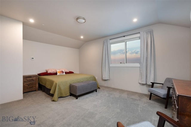 carpeted bedroom featuring lofted ceiling