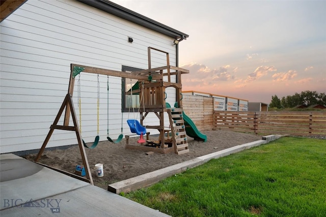 playground at dusk with a yard