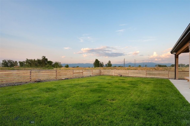 yard at dusk with a rural view