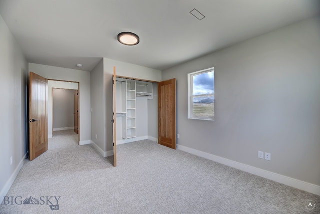 unfurnished bedroom with a closet and carpet floors