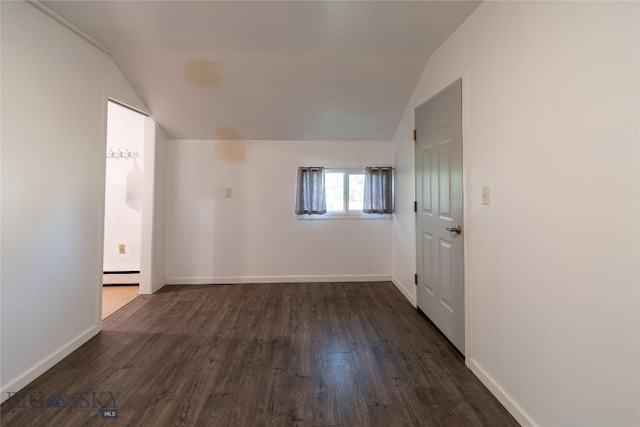 unfurnished room with a baseboard radiator, dark hardwood / wood-style floors, and lofted ceiling