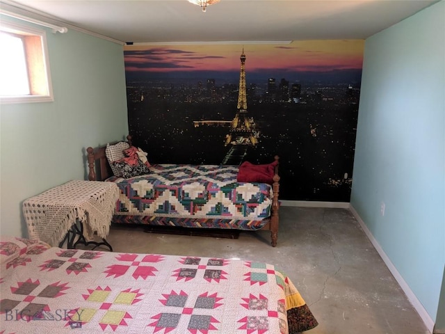 bedroom featuring baseboards and unfinished concrete floors