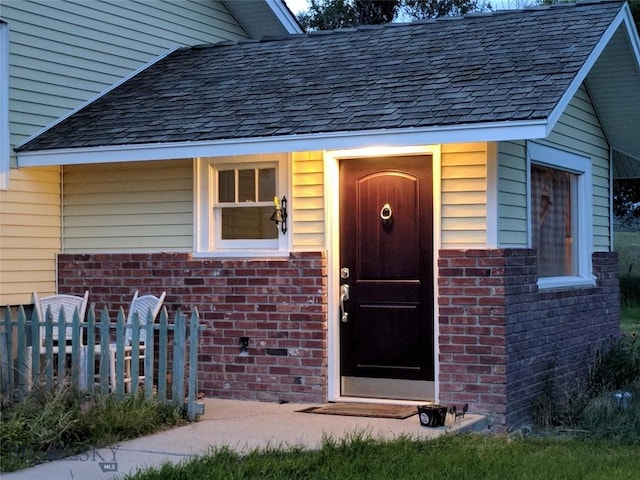 7 Robbins Ln, Whitehall, MT 59759 - property entrance with brick siding and fence