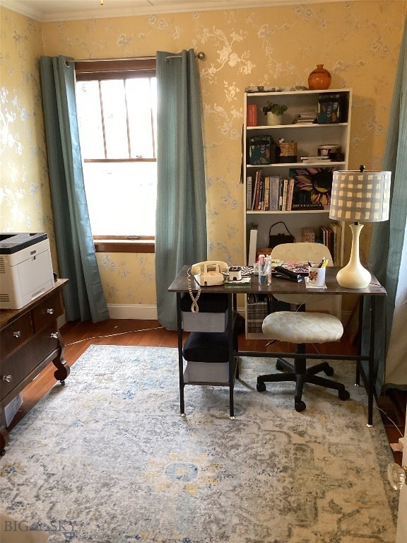 office area with baseboards, crown molding, wood finished floors, and wallpapered walls