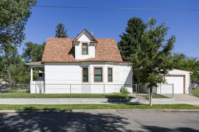 view of front of home featuring a garage, a fenced front yard, a shingled roof, and concrete driveway