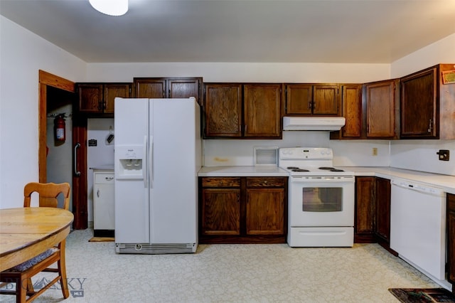 kitchen featuring light tile patterned floors and white appliances