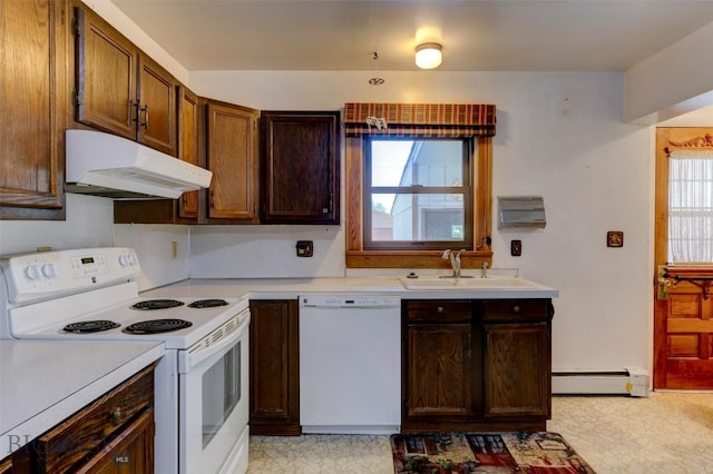 kitchen featuring white appliances, light countertops, under cabinet range hood, a baseboard heating unit, and a sink