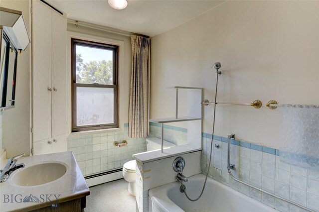 bathroom featuring vanity, a baseboard radiator, and toilet