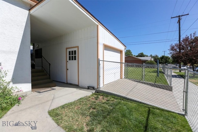 view of outbuilding featuring fence