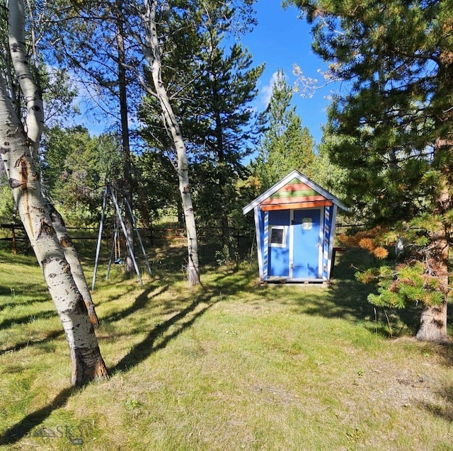 view of shed with fence