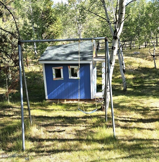 view of shed featuring fence
