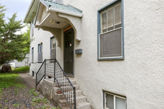 325 N 3rd St, Livingston, MT 59047 - doorway to property with stucco siding