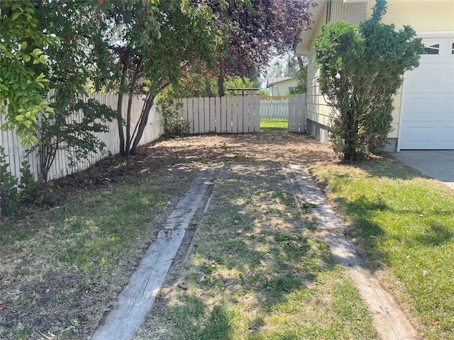 view of yard with a garage