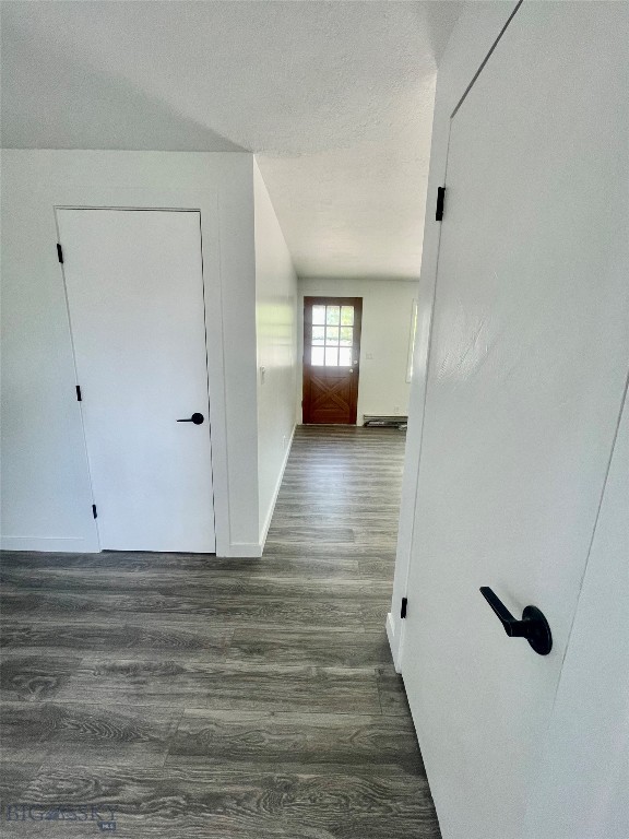 corridor featuring hardwood / wood-style flooring