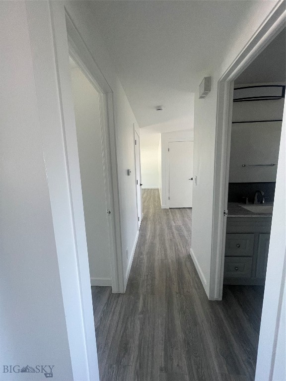 hallway featuring hardwood / wood-style flooring