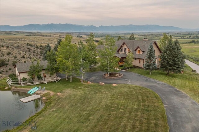 birds eye view of property featuring a mountain view and a rural view