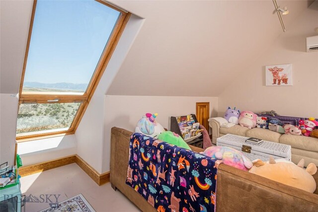 additional living space with a wall mounted air conditioner and lofted ceiling