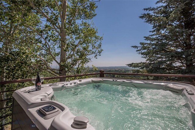 view of pool featuring a hot tub