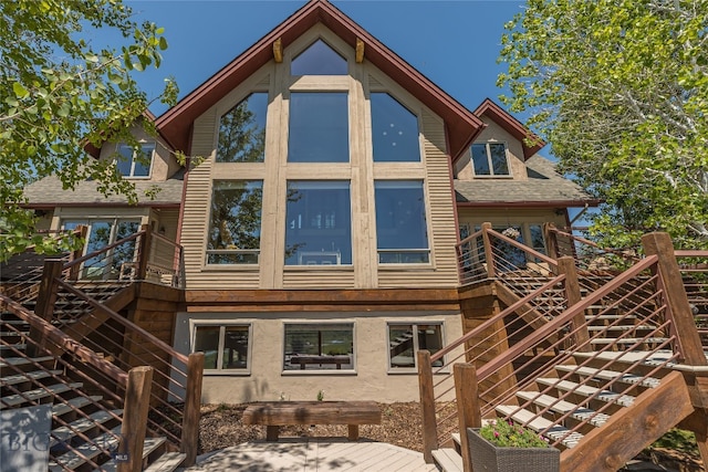 back of house with a wooden deck