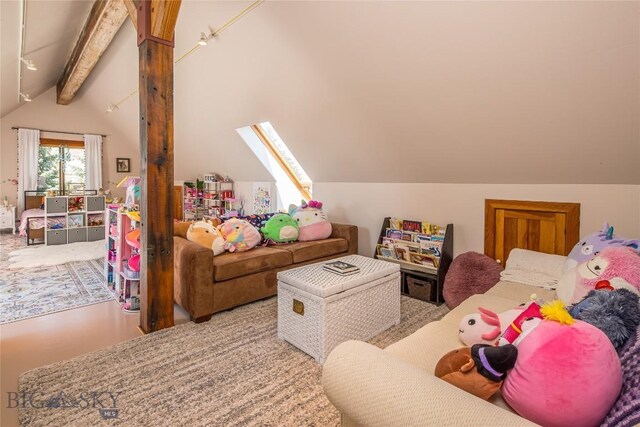 carpeted living room featuring lofted ceiling with skylight