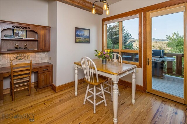 dining space with light wood-type flooring