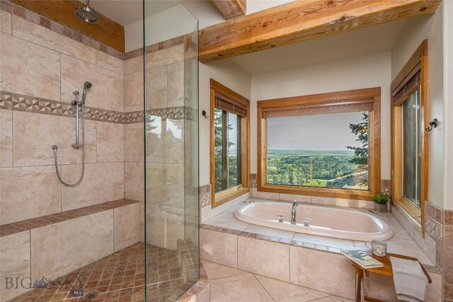 bathroom with tile patterned flooring and separate shower and tub