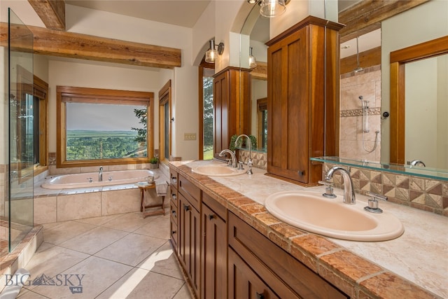 bathroom featuring tile patterned floors, separate shower and tub, and dual bowl vanity