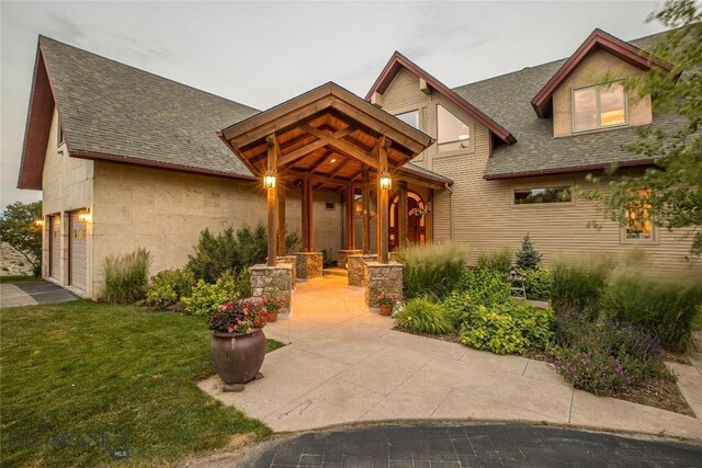 view of front facade with a garage and a front lawn