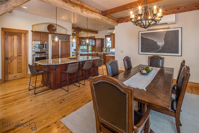 dining space with a wall mounted air conditioner, a notable chandelier, light hardwood / wood-style floors, and beam ceiling