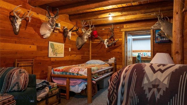 carpeted bedroom featuring beamed ceiling, wood ceiling, and wooden walls