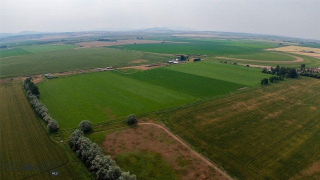 birds eye view of property with a rural view